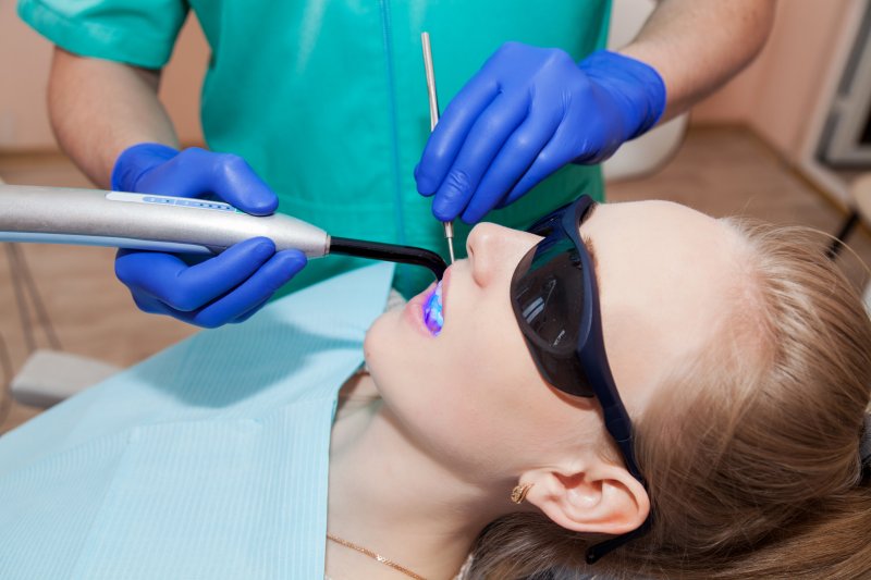 woman asleep receiving dental care